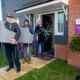 Darren Holloway and David Kelly from Emmaus Cambridge with sales advisor Stuart Burton from Ashberry Homes, outside the showhome at Cortlands in Fordham, with some of the furniture donated to the charity.