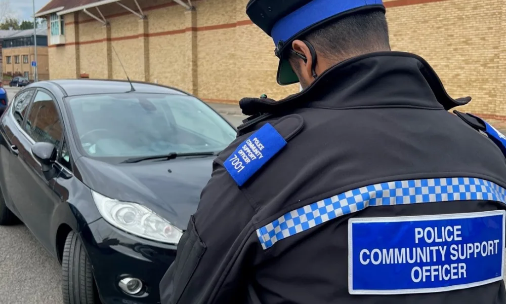 Gotcha! PCSO Ruben Borges gives a motorist a parking ticket in Huntingdon.