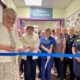 Anne-Marie Hamilton, previous Dreamdrops charity chair, cutting the blue ribbon during the official open with SCBU staff and charity representatives.