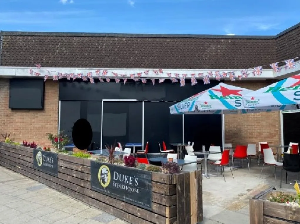 Duke’s Head, Wisbech. Planning application is for change of use of land to form a pub garden and erect a gate (0.91m high max), a timber canopy and timber planters (part retrospective).