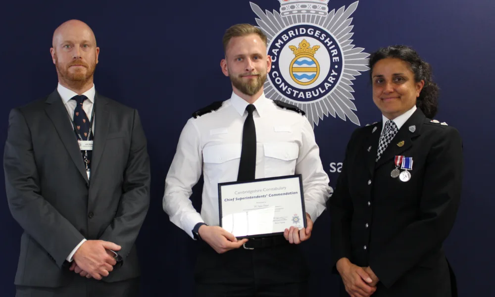 Pc Dane is pictured with Chief Superintendents Jon Hutchinson and Becky Tipping