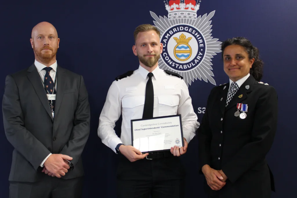 Pc Dane is pictured with Chief Superintendents Jon Hutchinson and Becky Tipping