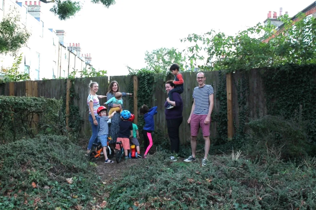 Lilywhite Drive residents next to a fence that currently blocks access to Corona Road