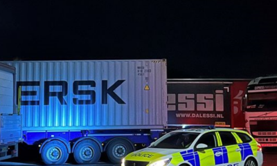 Four men have been charged following break-ins of 20 lorries at Cambridge services off the A14