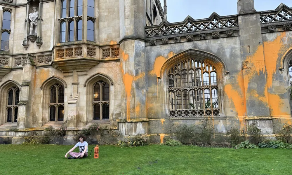 At around midday today, Chiara Sarti, a PhD student working in the department of Computer Science at Cambridge, used a fire extinguisher to spray orange paint over the iconic neo gothic gatehouse at King’s College.