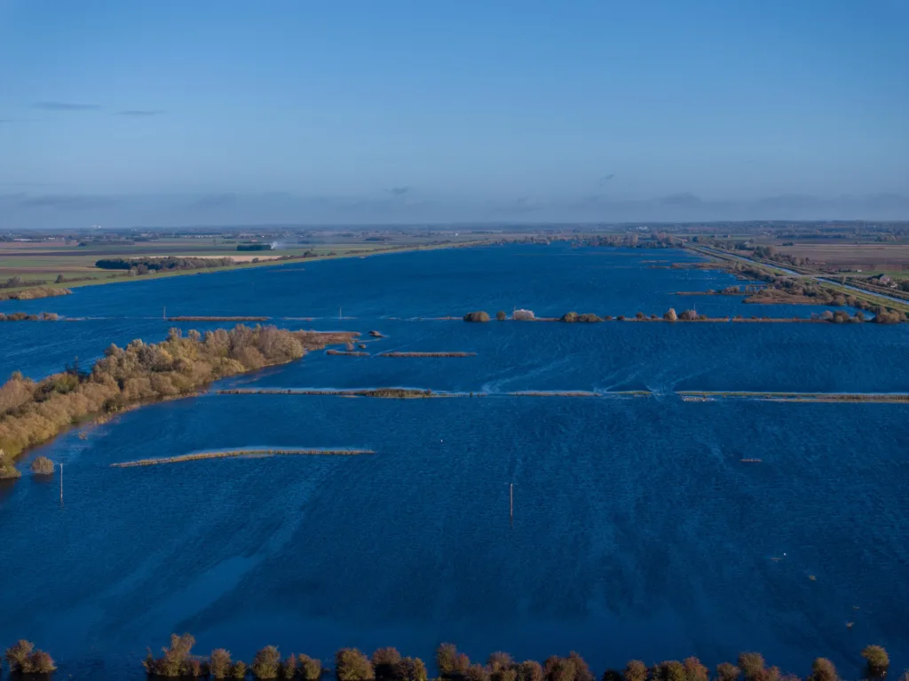 A1101 at Welney where many have chosen to find alternative routes today as water levels rise and most motorists have avoided, including those who attempted to cross but changed their mind. Bigger vehicles are still going through. PHOTO: Terry Harris for CambsNews 