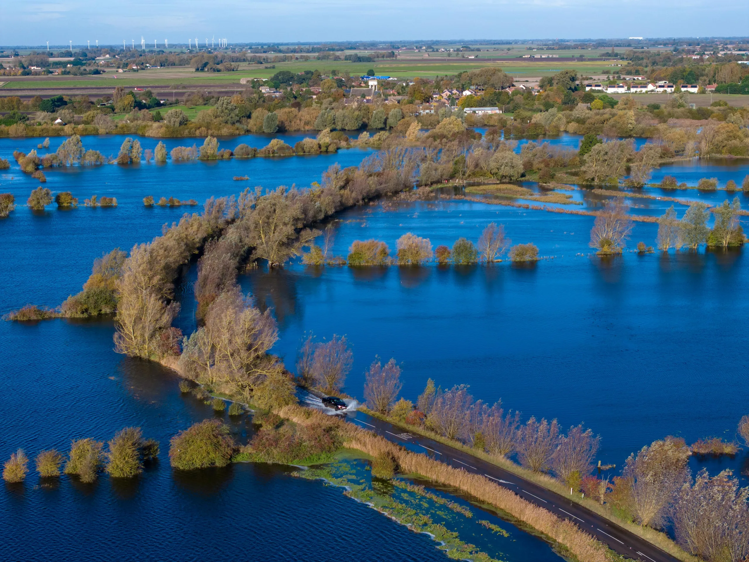 Residents of Welney are angry that full barriers are not being put across flooded Welney Wash Road. In Whittlesey, where roads are also flooded, full barriers prevent access. PHOTO: Bav Media