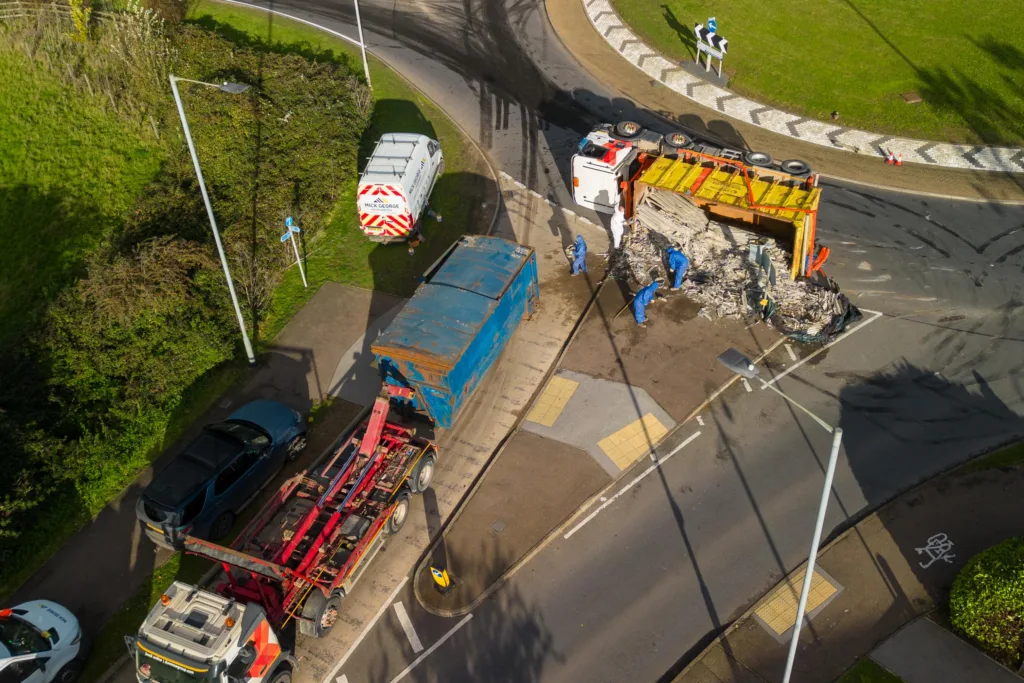 The scene at Witchford roundabout today as recovery takes place of the contents of a lorry that shed its load. PHOTO: Terry Harris for CambsNews
