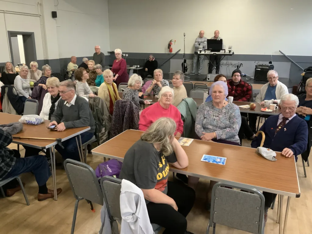 High Sheriff of Cambridgeshire, Dr Bharatkumar Khetani, cut the birthday cake as Walsoken Village Hall Community Coffee Morning celebrated its 2nd anniversary. Local police dropped in for a cuppa and cake. PHOTO: Wisbech Tweet 
