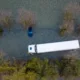 Abandoned car on the flooded A1101 in Welney, Norfolk, on Wednesday morning as the flooding continues after the recent heavy rain. PHOTO: BavMedia 