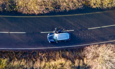 Driver pushing his car on the flooded A1101 in Welney in this morning (Mon). PHOTO: Bav Media