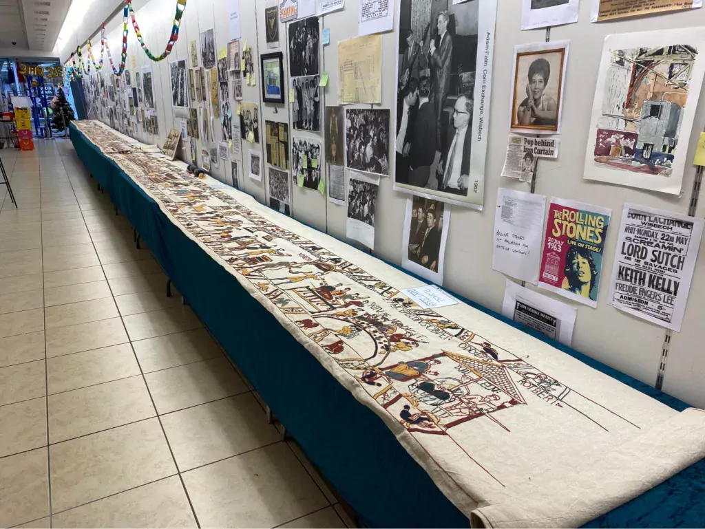 Mia Hanson took part of her Bayeux Tapestry to Wisbech Corn Exchange Conservation Trust's exhibition hall on Saturday: she was able to display almost 16 metres of tapestry. The walls were lined with photos and information about The Corn Exchange. 