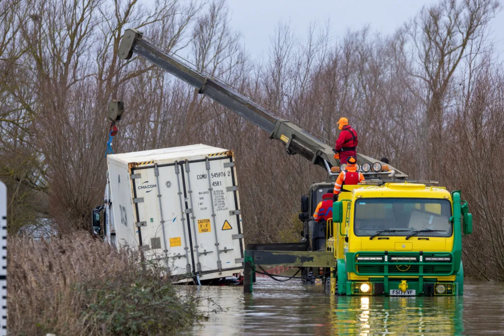 An articulated lorry was finally recovered from a flooded A1101 at Welney in Norfolk today (Thurs) after being stuck in the deep water for four days. PHOTO: Bav Media 