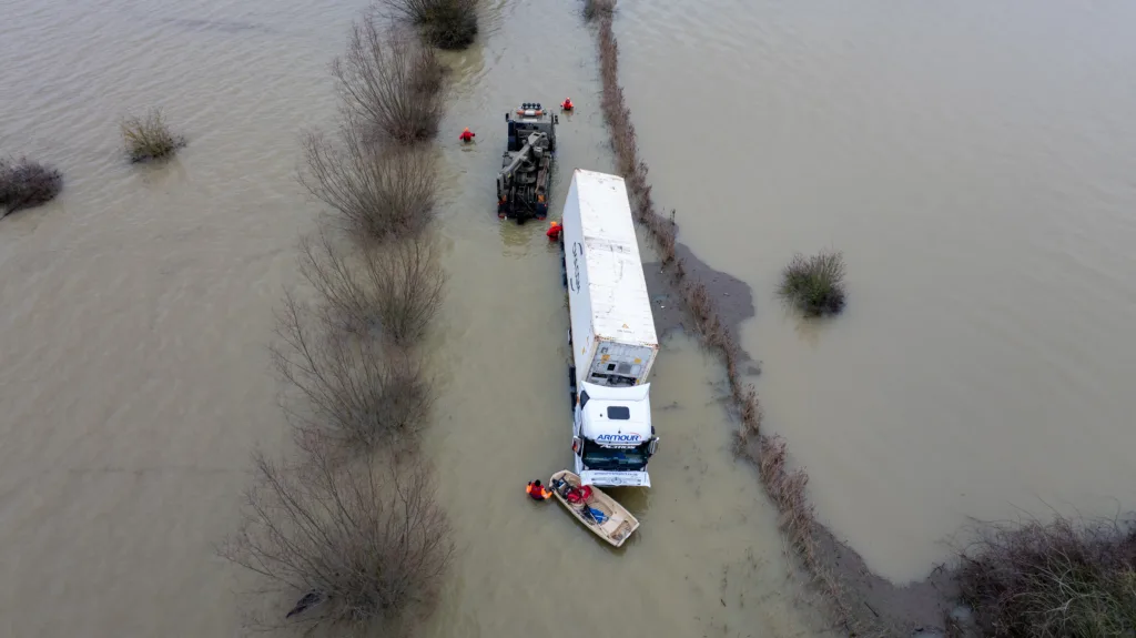 An articulated lorry was finally recovered from a flooded A1101 at Welney in Norfolk today (Thurs) after being stuck in the deep water for four days. PHOTO: Bav Media 