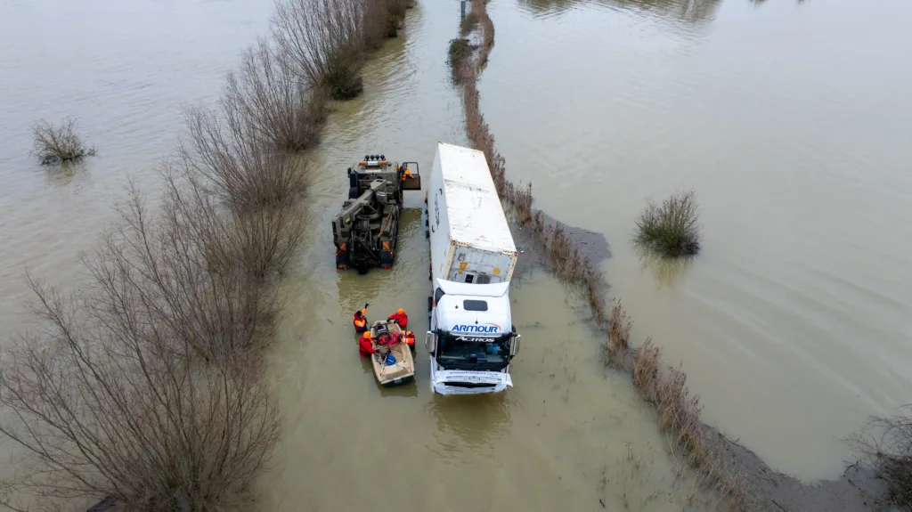 An articulated lorry was finally recovered from a flooded A1101 at Welney in Norfolk today (Thurs) after being stuck in the deep water for four days. PHOTO: Bav Media 