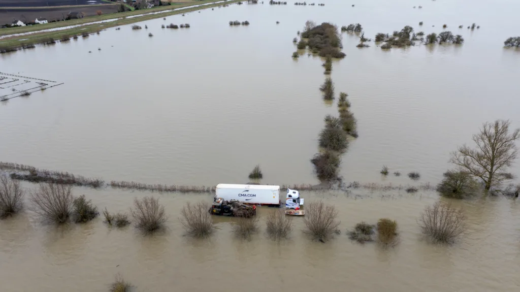 An articulated lorry was finally recovered from a flooded A1101 at Welney in Norfolk today (Thurs) after being stuck in the deep water for four days. PHOTO: Bav Media 