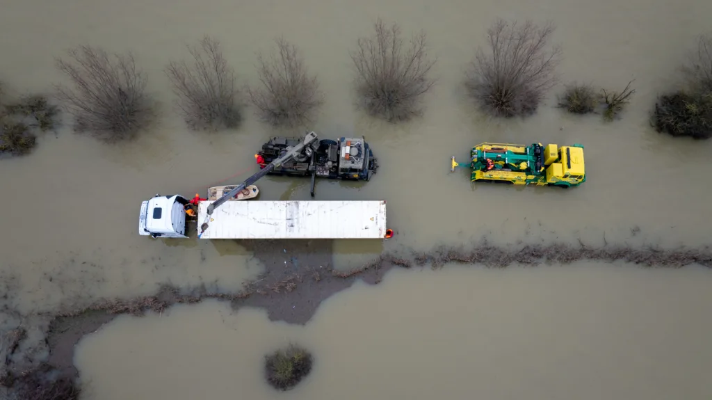 An articulated lorry was finally recovered from a flooded A1101 at Welney in Norfolk today (Thurs) after being stuck in the deep water for four days. PHOTO: Bav Media 