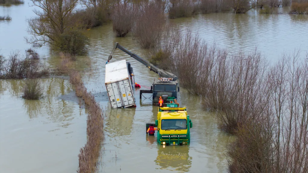 An articulated lorry was finally recovered from a flooded A1101 at Welney in Norfolk today (Thurs) after being stuck in the deep water for four days. PHOTO: Bav Media 