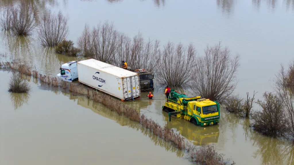 An articulated lorry was finally recovered from a flooded A1101 at Welney in Norfolk today (Thurs) after being stuck in the deep water for four days. PHOTO: Bav Media 