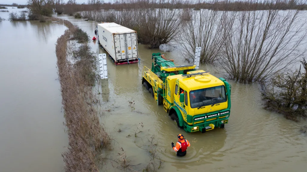 An articulated lorry was finally recovered from a flooded A1101 at Welney in Norfolk today (Thurs) after being stuck in the deep water for four days. PHOTO: Bav Media 