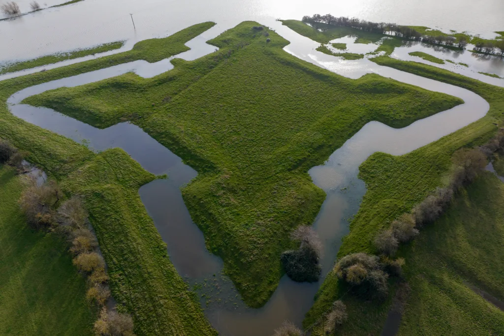 Flooding reveals English Civil War fort after Storm Henk. The clear outline of a 400-year-old English Civil War fort has been highlighted after heavy rain and flooding filled a moat around the earthworks following Storm Henk. Aerial photos show The Earith Bulwark in the Cambridgeshire Fens, which was built around 1643 by Oliver Cromwell's forces to protect crossing points on the local rivers, including the River Great Ouse. Picture by Terry Harris.