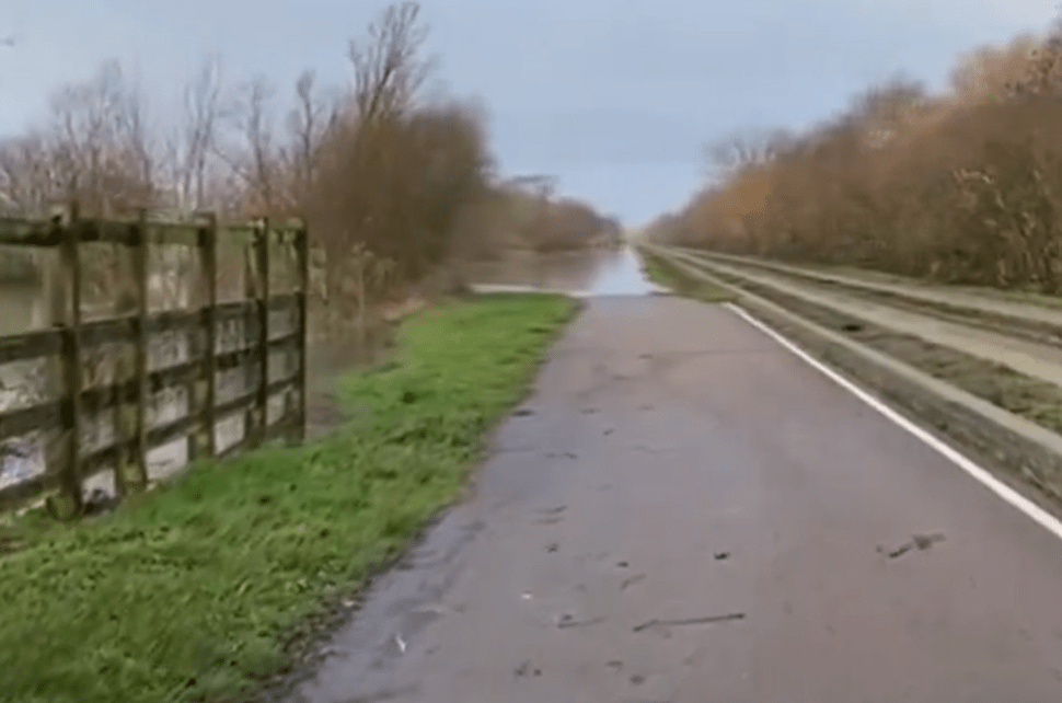 Photos from Cambridgeshire County Council show the maintenance track of the guided busway flooded between Swavesey and St Ives 
