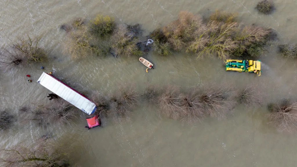 Recovery team from Manchetts were praised for their efforts in retrieving this cab and trailer that the driver was forced to abandon in the early hours of Monday on the flooded A1101 Welney Wash Road. PHOTO: Bav Media 