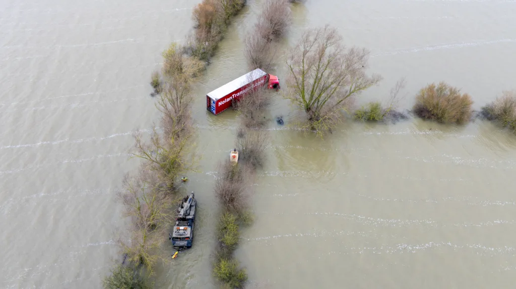 Recovery team from Manchetts were praised for their efforts in retrieving this cab and trailer that the driver was forced to abandon in the early hours of Monday on the flooded A1101 Welney Wash Road. PHOTO: Bav Media 