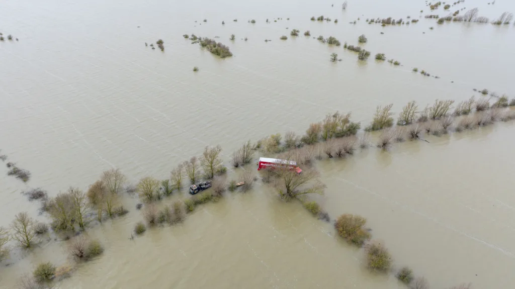 Recovery team from Manchetts were praised for their efforts in retrieving this cab and trailer that the driver was forced to abandon in the early hours of Monday on the flooded A1101 Welney Wash Road. PHOTO: Bav Media 