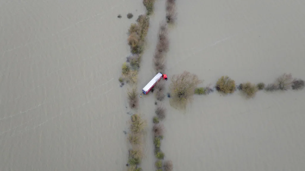 Recovery team from Manchetts were praised for their efforts in retrieving this cab and trailer that the driver was forced to abandon in the early hours of Monday on the flooded A1101 Welney Wash Road. PHOTO: Bav Media 