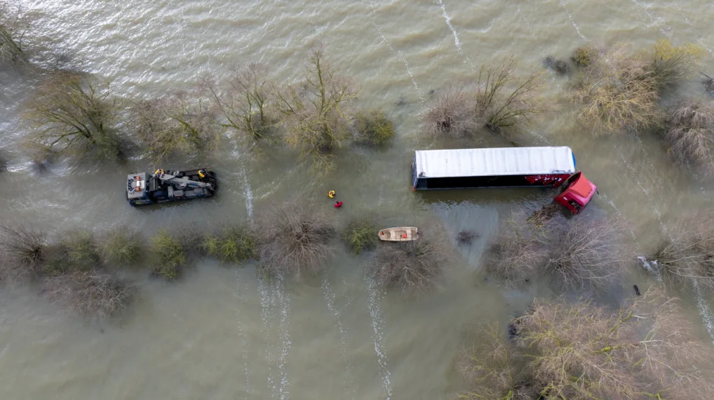 Recovery team from Manchetts were praised for their efforts in retrieving this cab and trailer that the driver was forced to abandon in the early hours of Monday on the flooded A1101 Welney Wash Road. PHOTO: Bav Media 