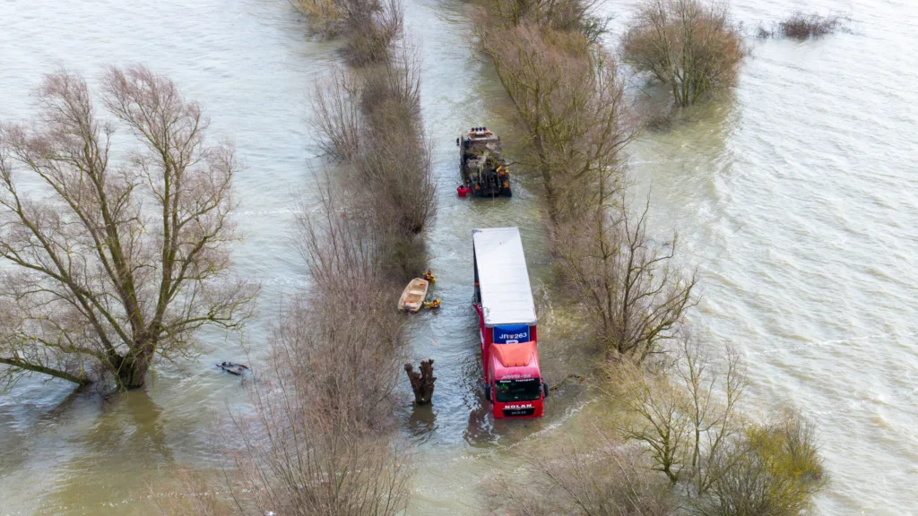 Recovery team from Manchetts were praised for their efforts in retrieving this cab and trailer that the driver was forced to abandon in the early hours of Monday on the flooded A1101 Welney Wash Road. PHOTO: Bav Media 