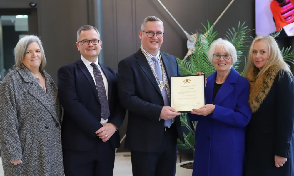 Cllr Mac McGuire's wife and daughters receiving the Honorary Alderman award (left to right): Catherine McGuire, Stephen Moir, Cllr Sebastian Kindersley, Viv McGuire, Michelle Sowman).