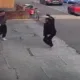 Shortly after being attacked and robbed, a brave shopworker is seen hitting back at her attacker outside her shop. IMAGE: Cambs Police