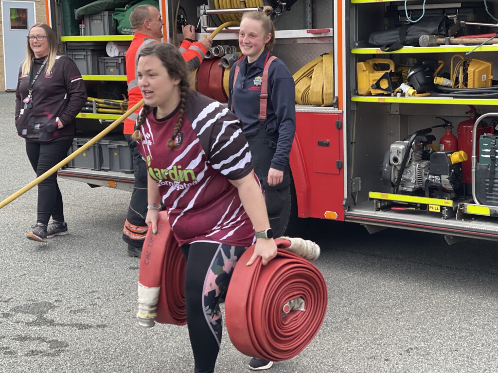 The women’s team of March Bears Rugby Club learn some basic fire fighter techniques during a visit to March Fire Station. PHOTO: Cambs Fire and Rescue