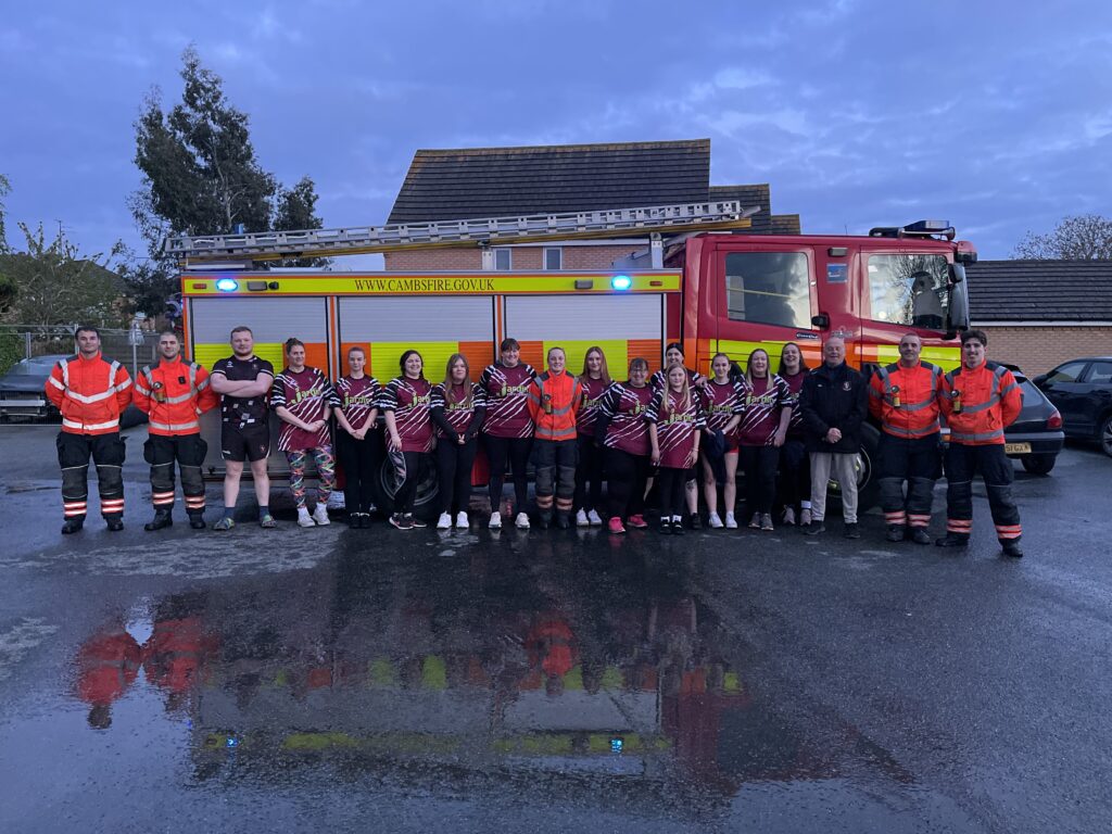 The women’s team of March Bears Rugby Club learn some basic fire fighter techniques during a visit to March Fire Station. PHOTO: Cambs Fire and Rescue