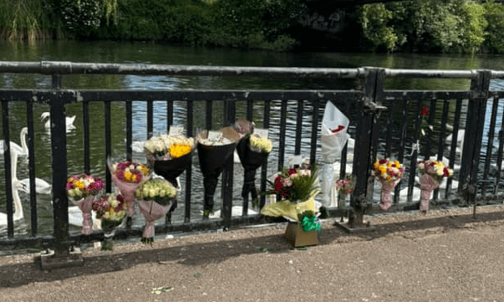 Flowers left on Peterborough town bridge after a man drowned after he jumped into the River Nene to escape police.