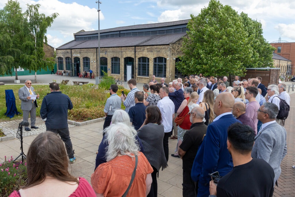 A plaque to commemorate Charles Swift after a square was named in his honour was unveiled today by his widow Brenda. Brenda was joined by close family and friends and many councillors Including the Mayor Marco Cereste who hosted the event. Charles Swift Square, Peterborough Thursday 27 June 2024. Picture by Terry Harris.