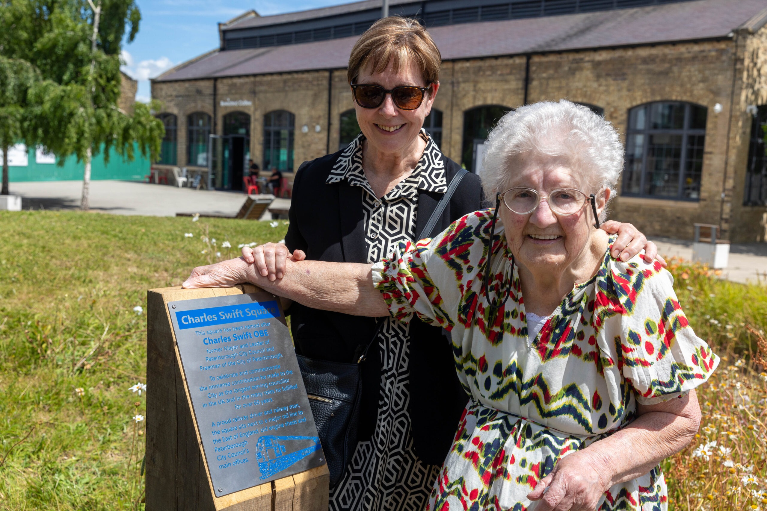 A plaque to commemorate Charles Swift after a square was named in his honour was unveiled today by his widow Brenda.  Brenda was joined by close family and friends and many councillors Including the Mayor Marco Cereste who hosted the event. Charles Swift Square, Peterborough Thursday 27 June 2024. Picture by Terry Harris.