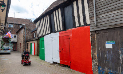 Wisbech town councillor Shahid Rafique facing an outcry after he painted a 15th century listed building red, white and green – to match the colours of his Italian Affairs restaurant