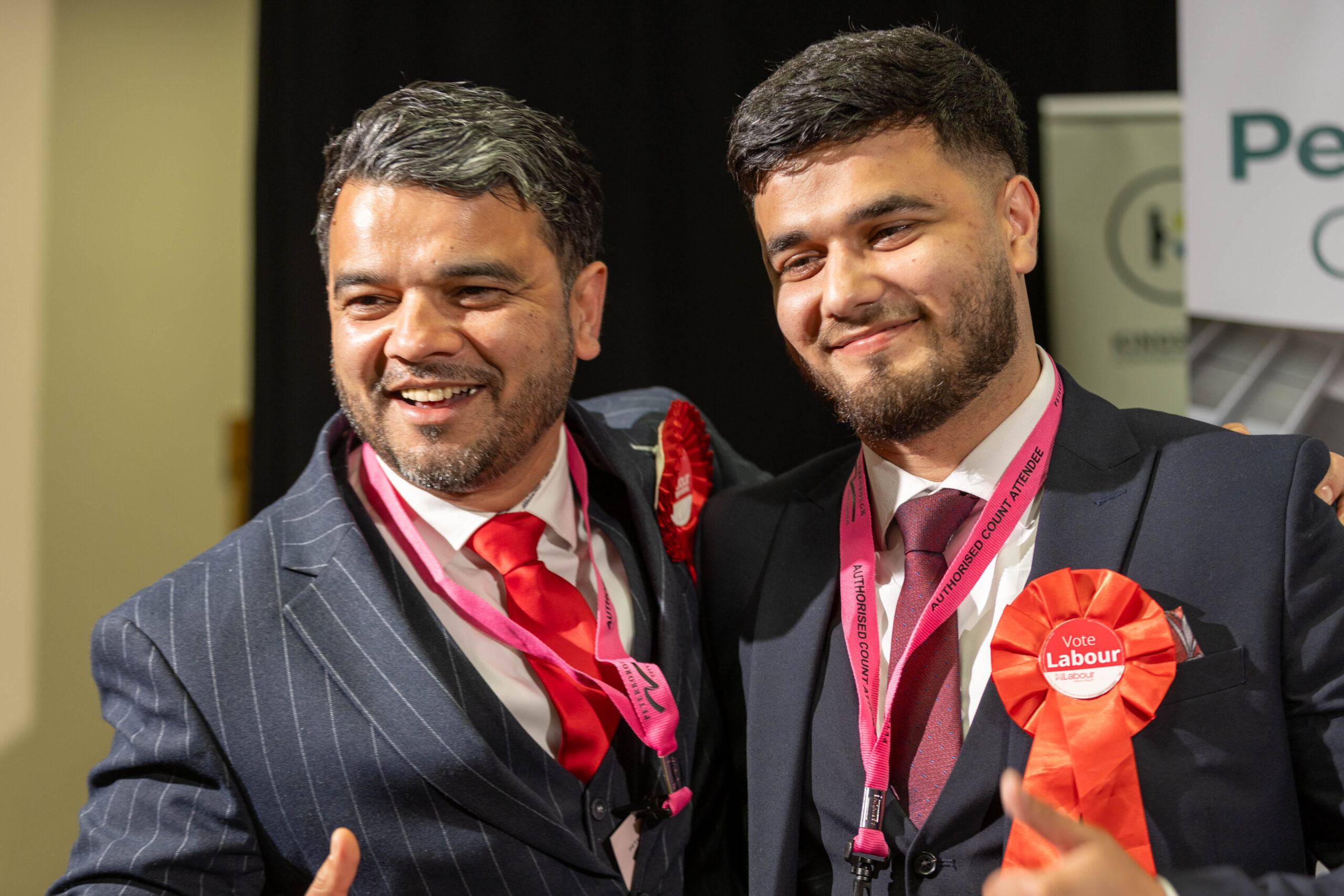 Councillor Amjad Iqbal (left) celebrating his election success in May PHOTO: Terry Harris