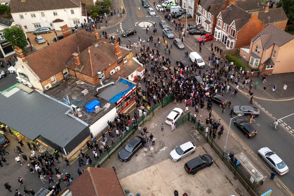 ‘Peterborough riots are so peaceful it’s just showing y’all what’s community spirit,’ wrote one man. Counter protestors congregate on Lincoln Road following social media threats to burn a local immigration centre. Millfield, Peterborough Wednesday 07 August 2024. PHOTO: Terry Harris.